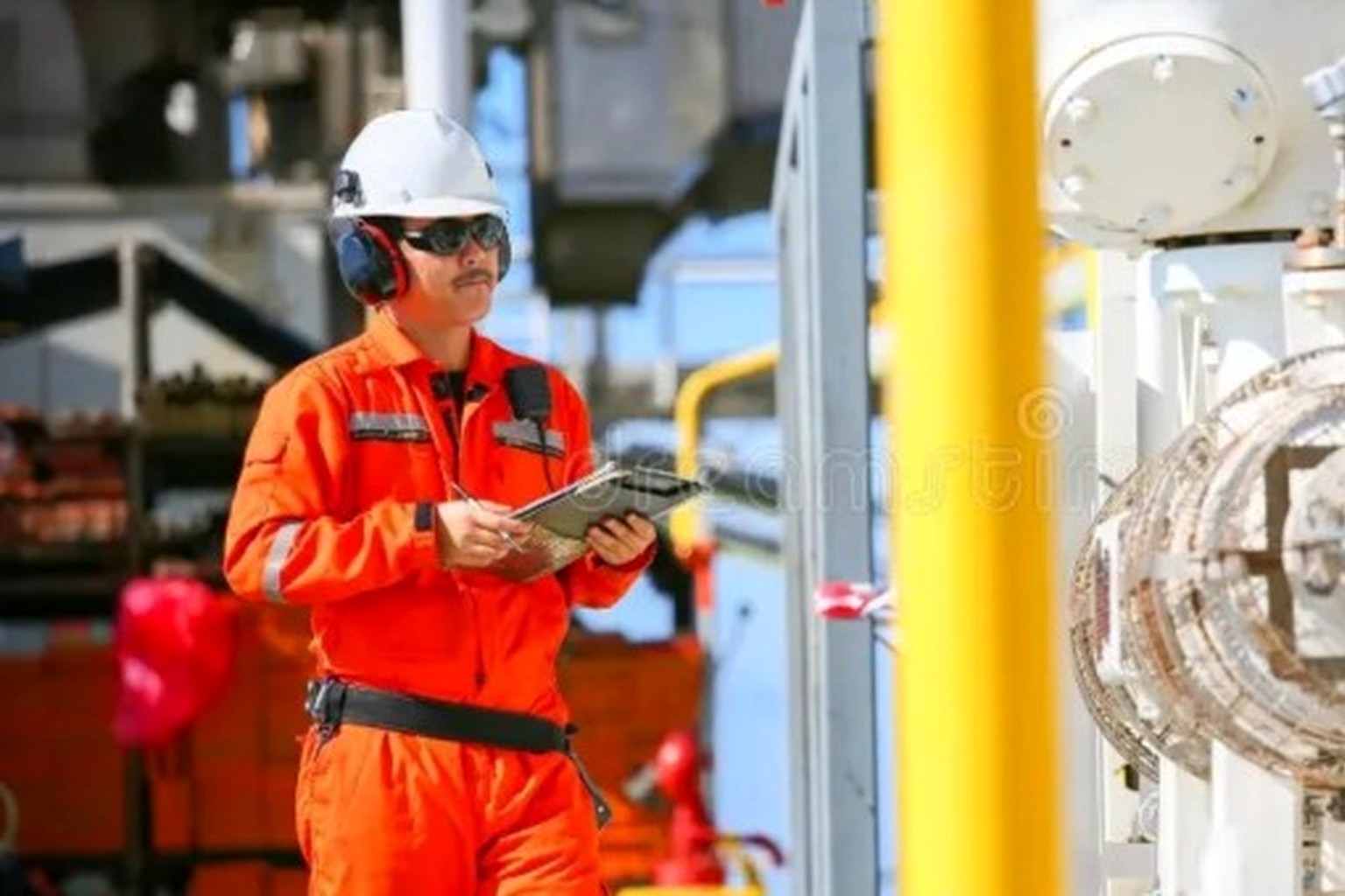 Independent HSE auditor reviewing evidence during a site assurance inspection